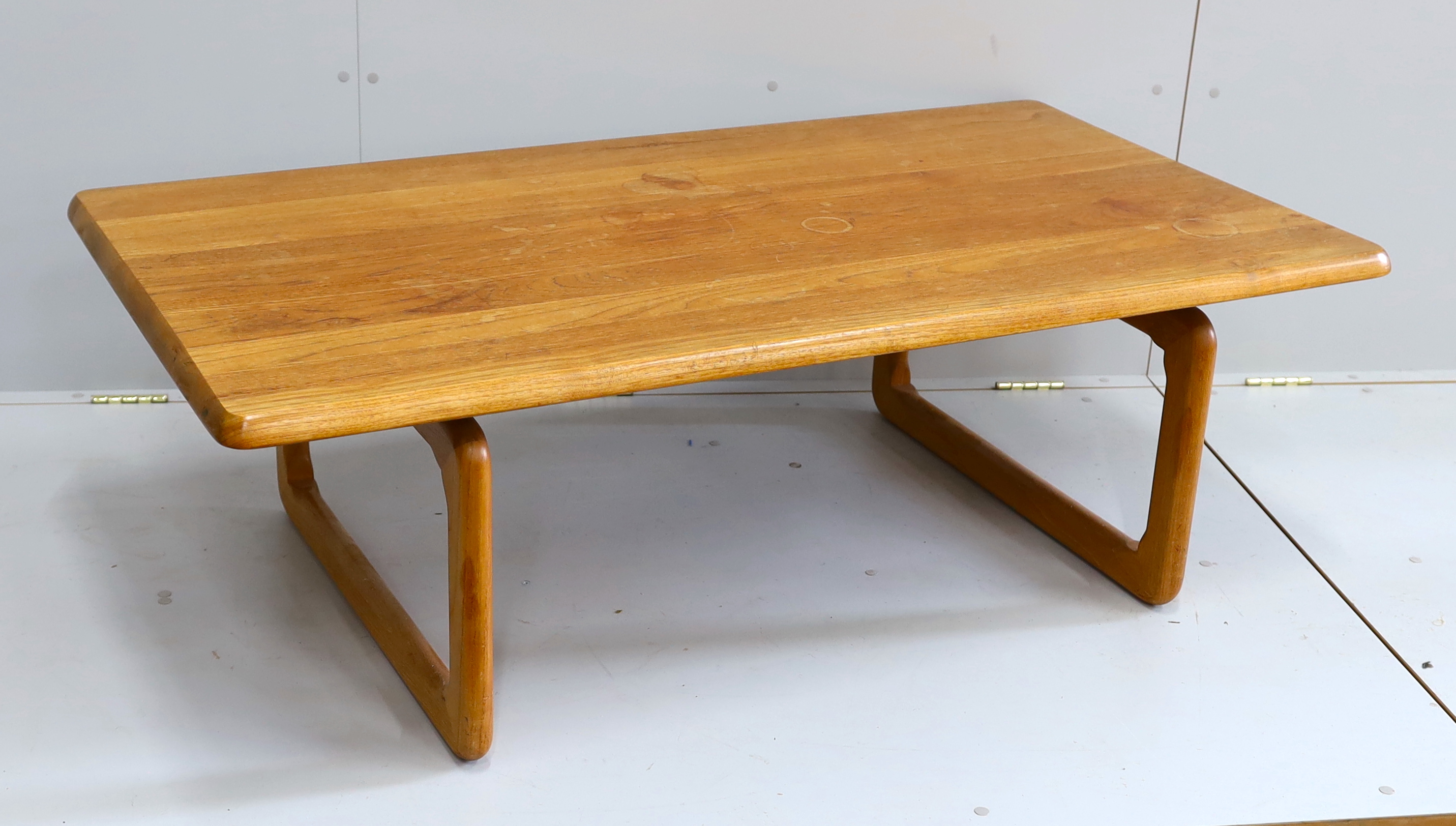 Attributed to Niels Bach, a rectangular mid century teak coffee table, width 138cm, depth 74cm, height 45cm
